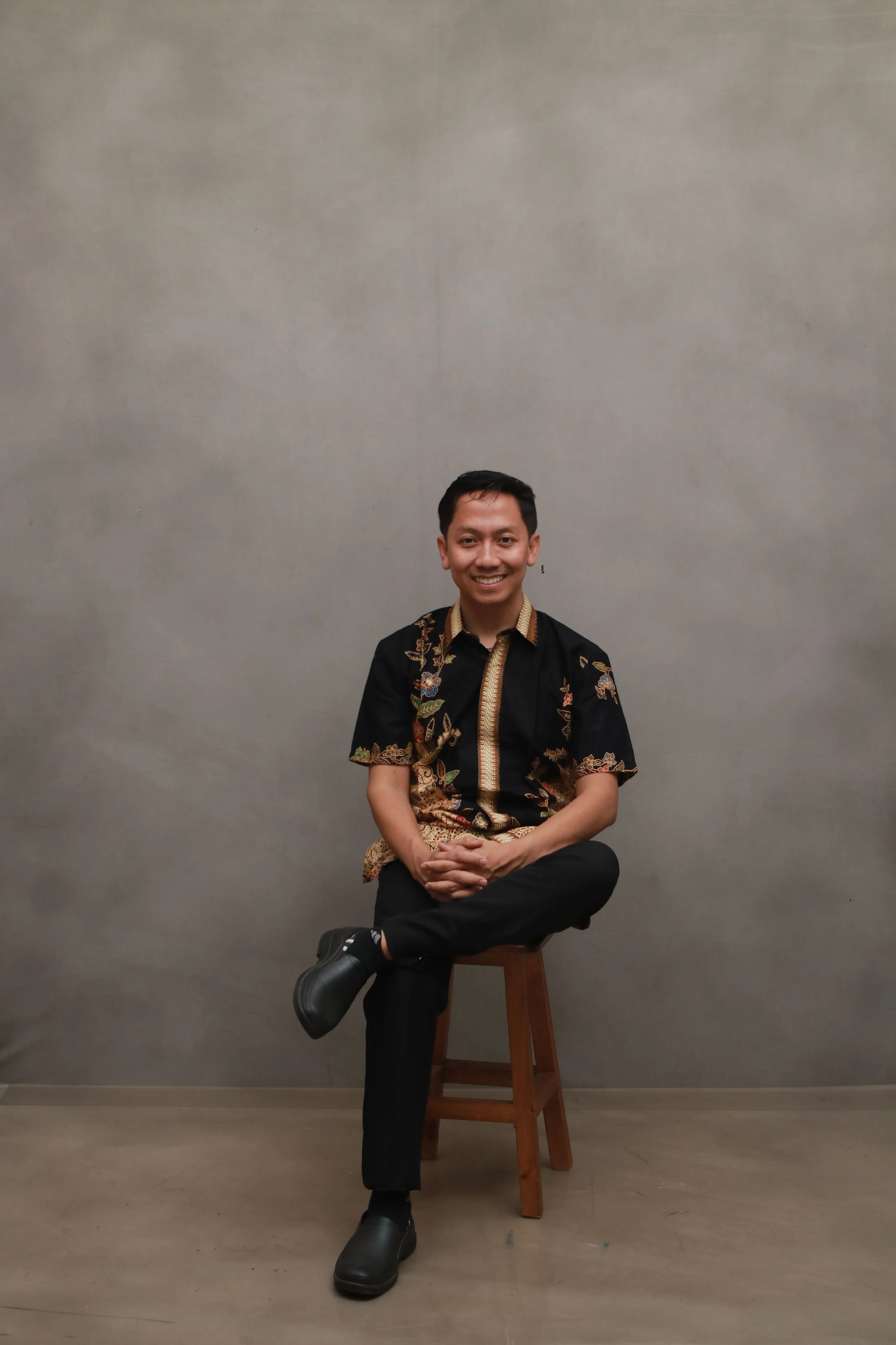 Mas Ridwan portrait — batik shirt